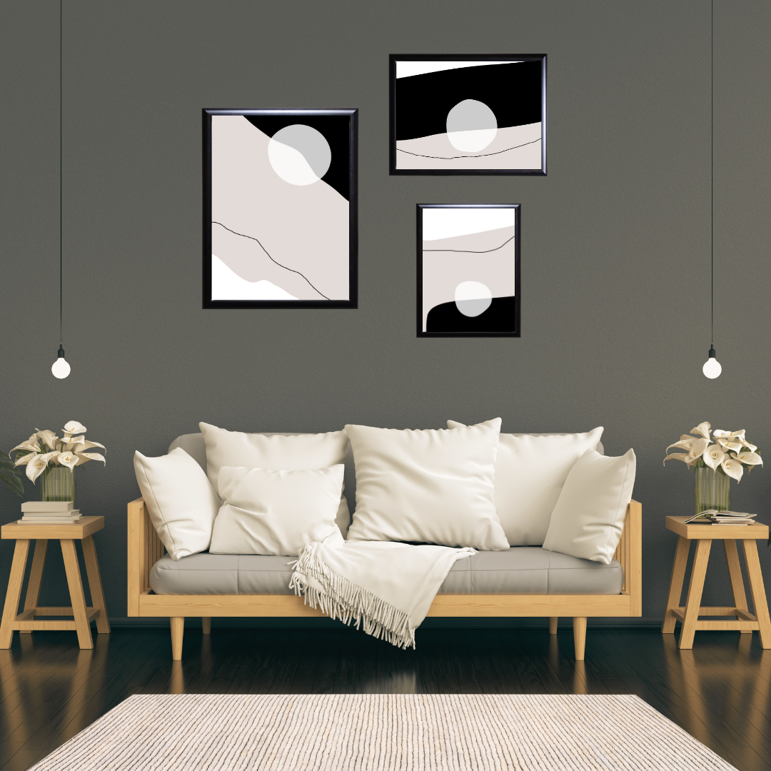 Neutral geometric abstract wall art trio displayed in a boho-style living room.