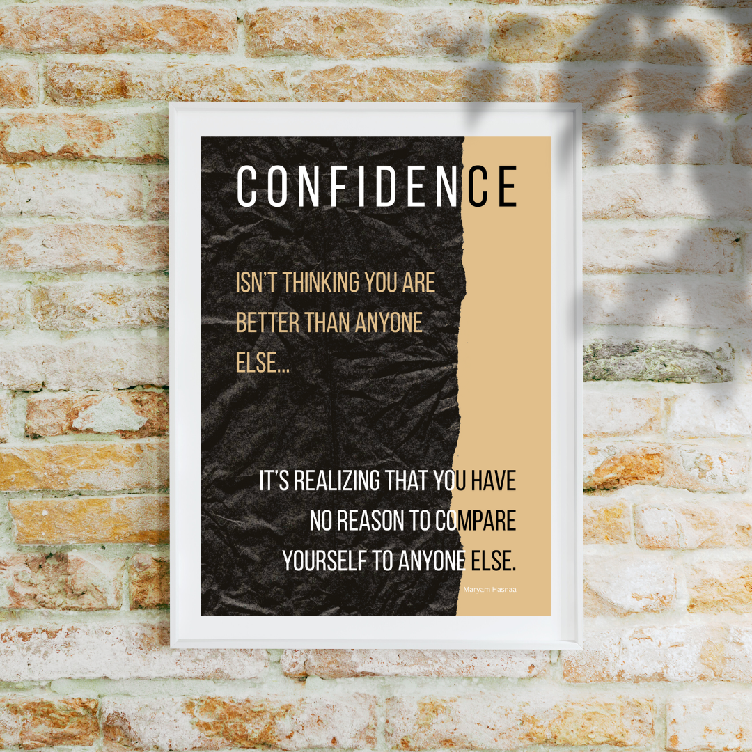 Close‑up of “Confidence” quote print in white frame, highlighting brickwork in the background.