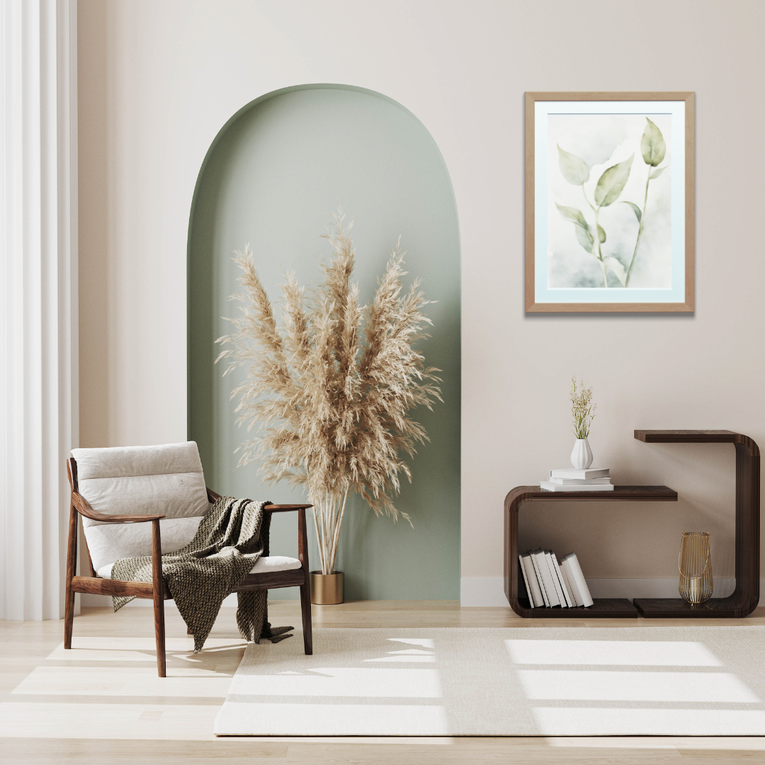 Framed botanical print with neutral tones of faded sage and smokey cream in a minimalist setting.