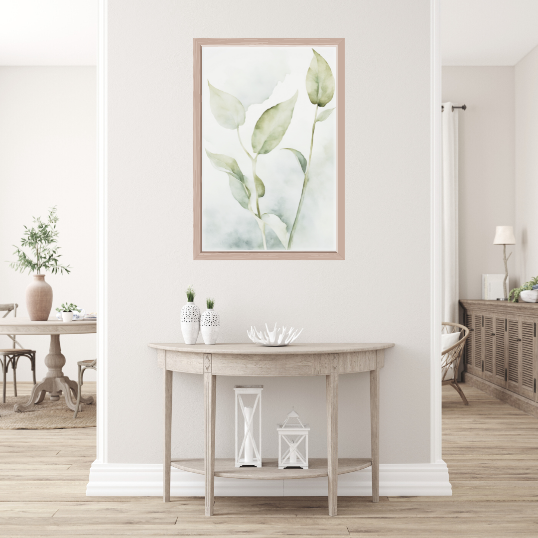Single faded botanical leaf artwork in muted olive and beige displayed in a neutral-painted room with rattan furniture.