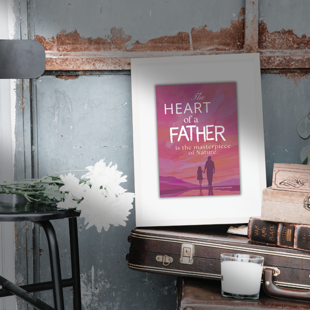 Close-up of framed print atop vintage brown suitcase surrounded by flowers, old books and a candle.