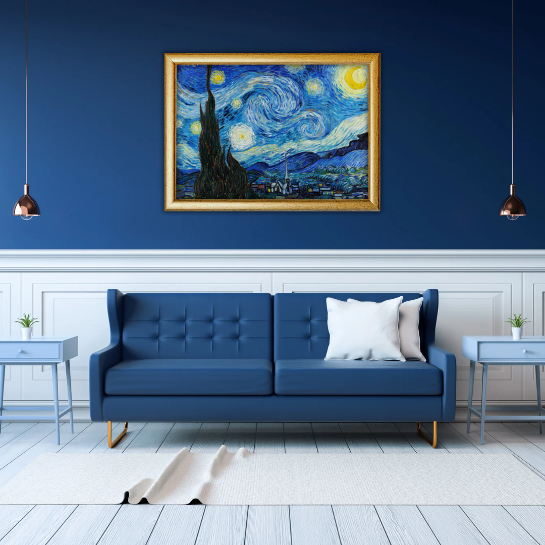 Framed Van Gogh Starry Night print above a navy leather sofa in a modern office reception area.