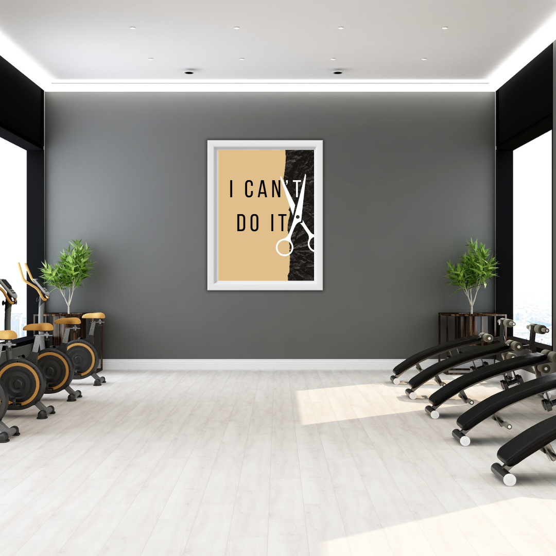 Motivational “Cut the Can’t” print on dark wall in modern gym with stationary bikes.