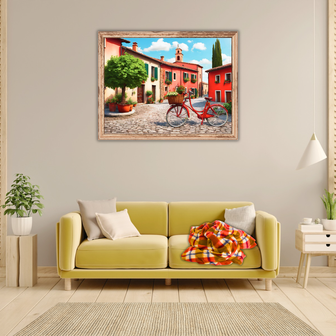 Living room vignette showing vibrant village canvas over a pale-yellow sofa with a red checkered blanket.