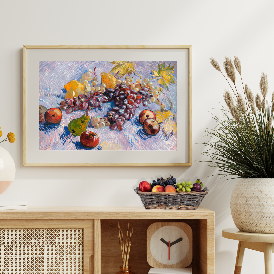 Framed Post‑Impressionist fruit painting adding warmth to a wood sideboard.