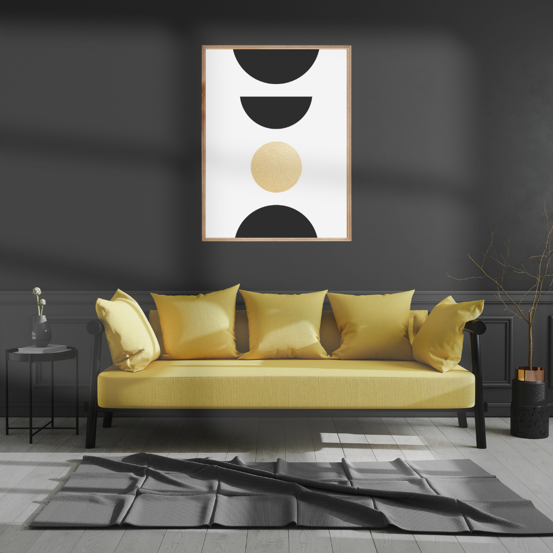Yellow sofa with decorative pillows in a modern living room setting with boho gold and black art print.