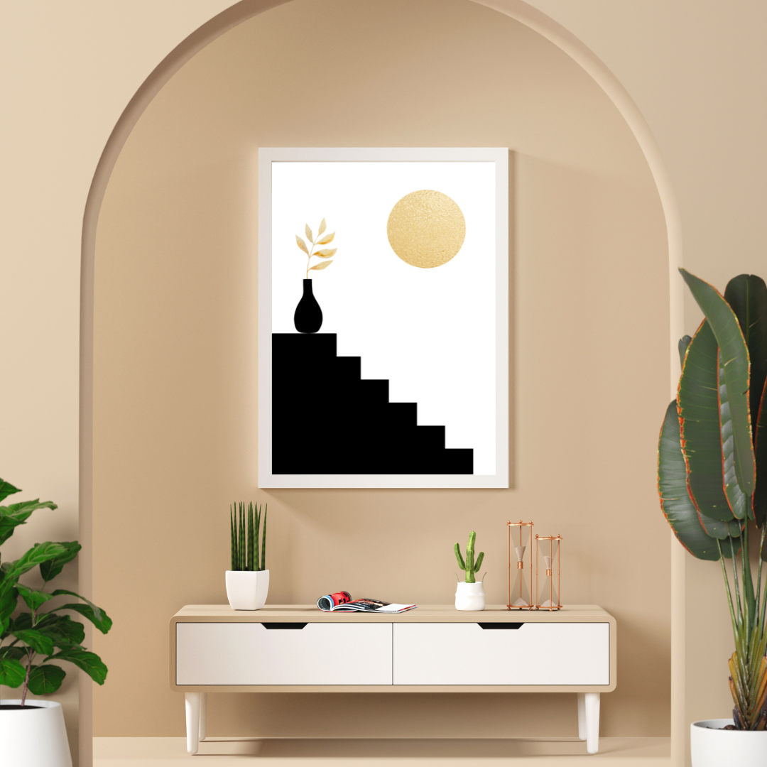 Framed abstract art piece on a beige wall with a white console table below showcased behind an arch.