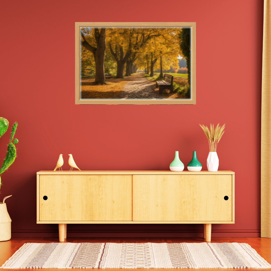 Framed autumn path print, above a light‑wood sideboard with ceramics with a deep red backdrop.