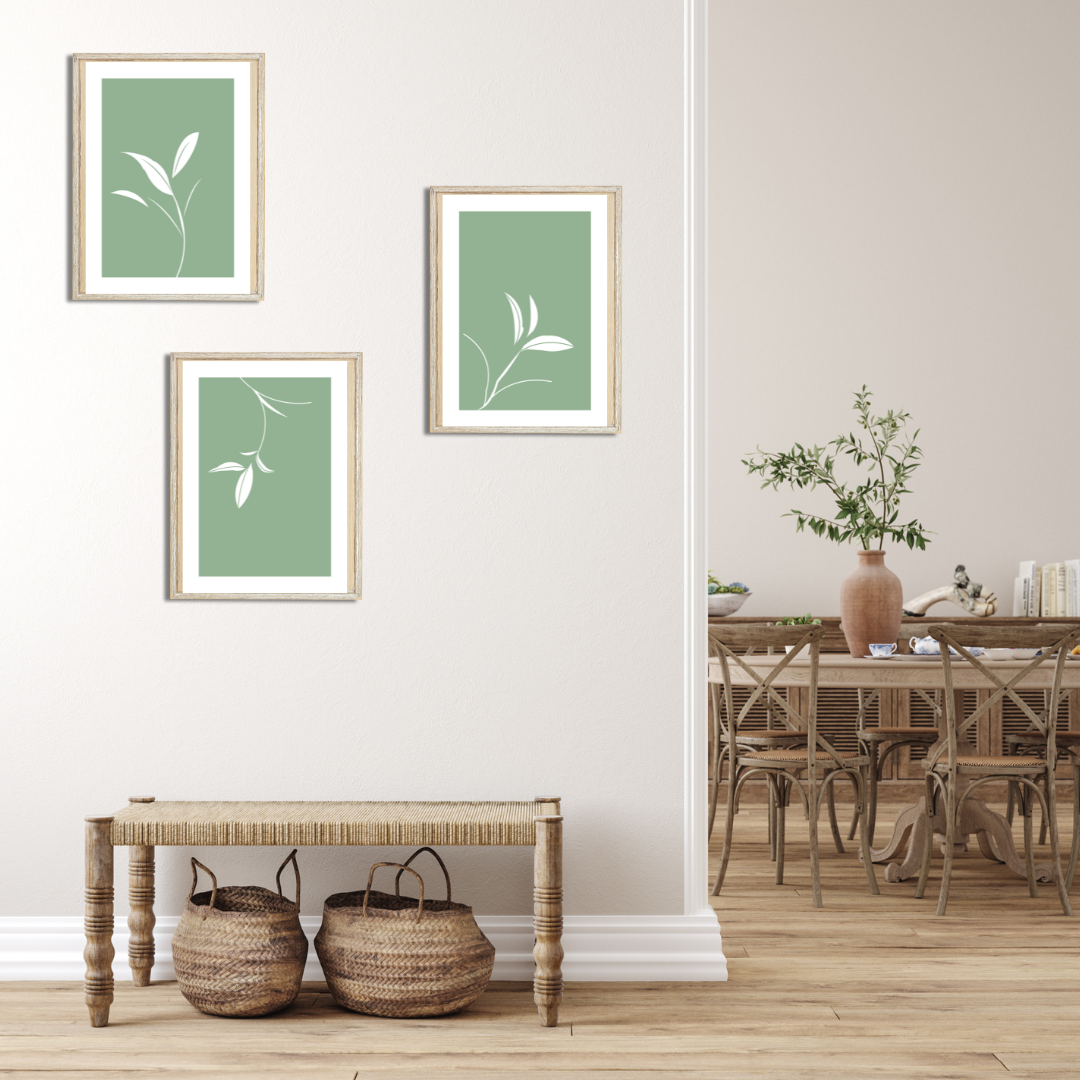 Framed sage botanical set displayed in a boho styled entrance with neutral tones rattan decor.