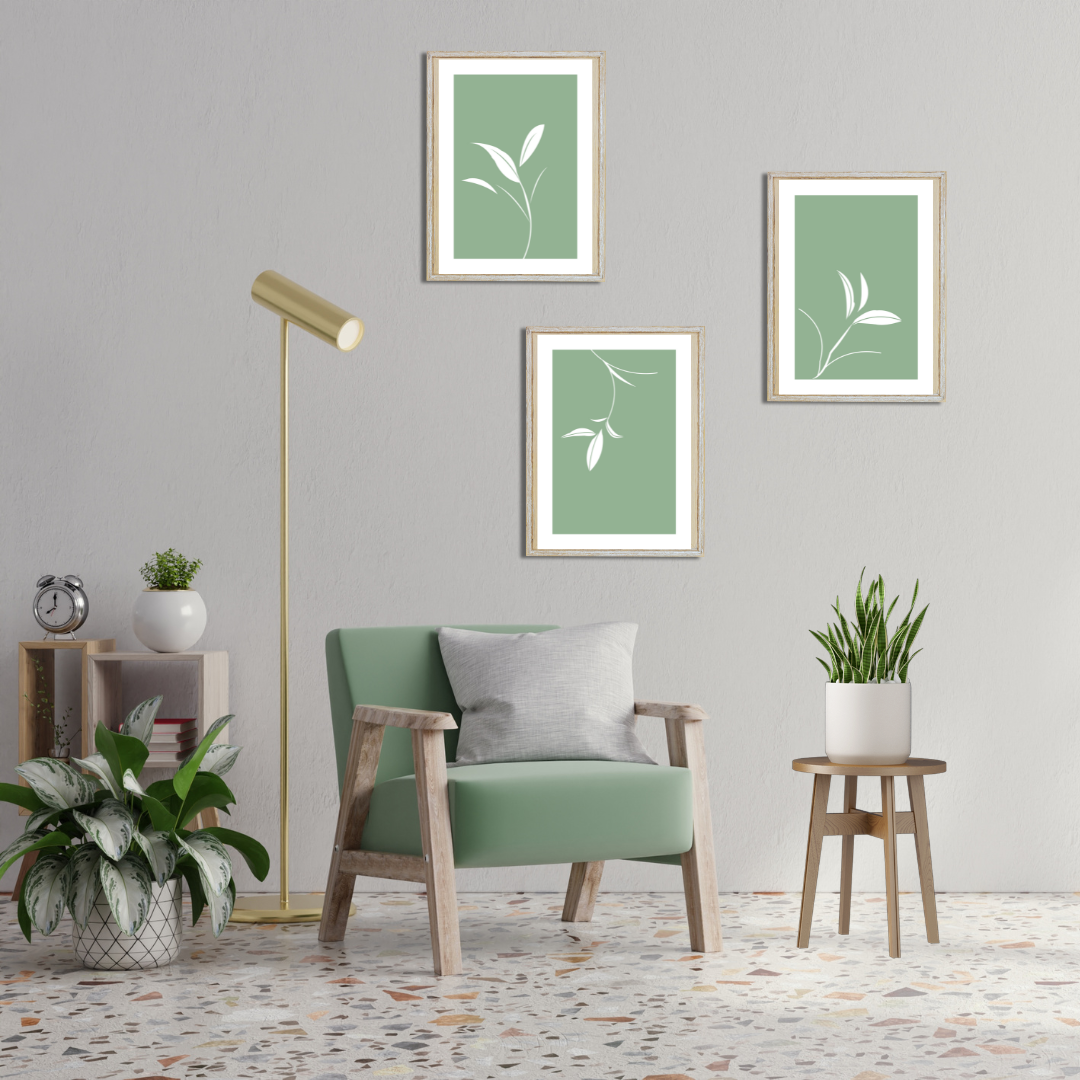 Set of 3 digital botanical art prints with clean lines and calming sage tones in a home interior.