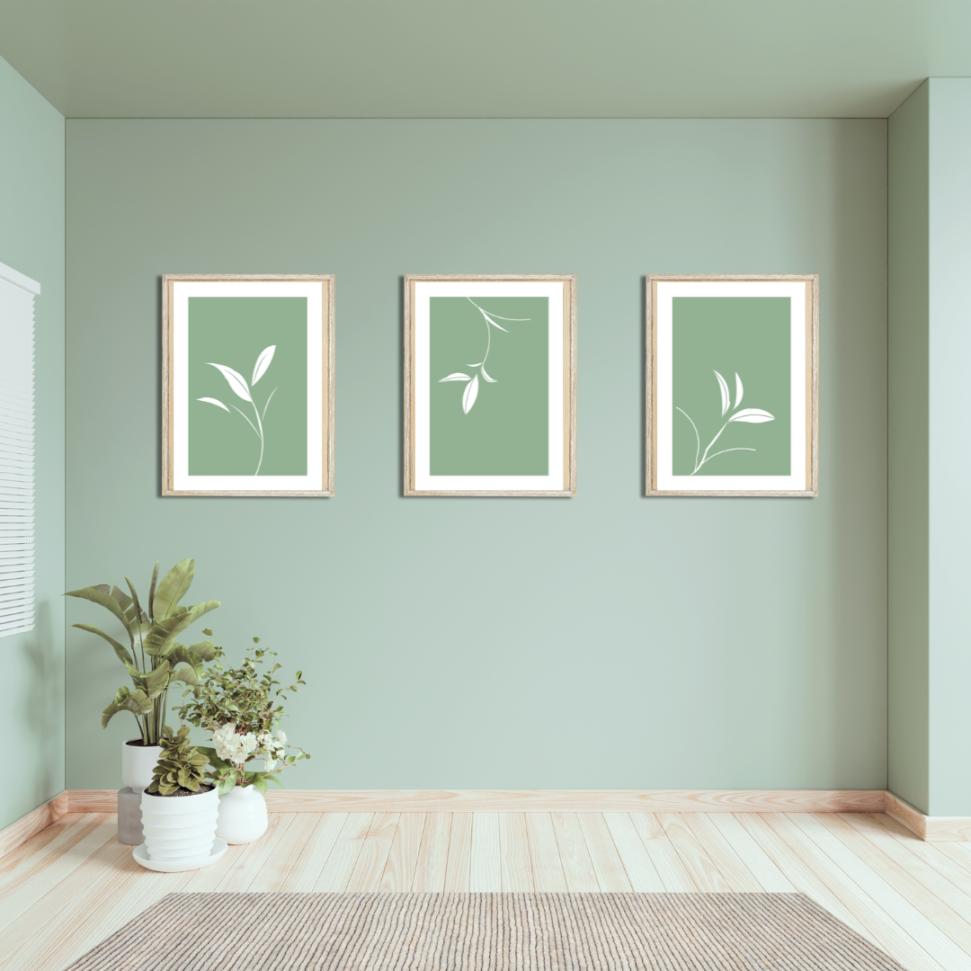 Detail view of soft green background with negative space and white botanical linework in a wooden and sage green setting.