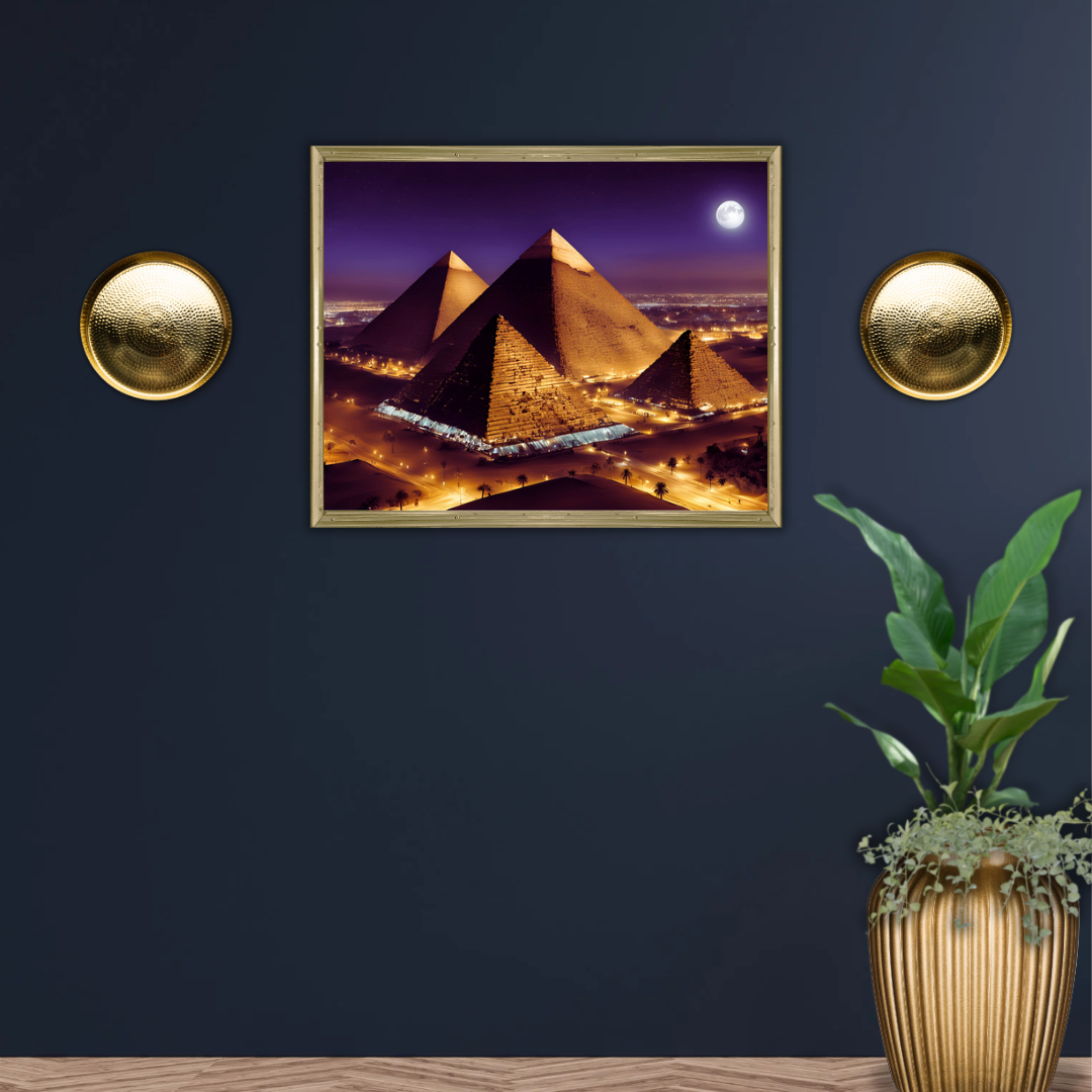 Deep blue wall featuring pyramids cityscape canvas surrounded by gold and plant decor.