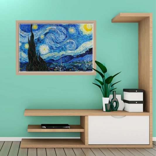Close‑up of Starry Night print in natural wood frame above a minimalist shelf with ceramics.