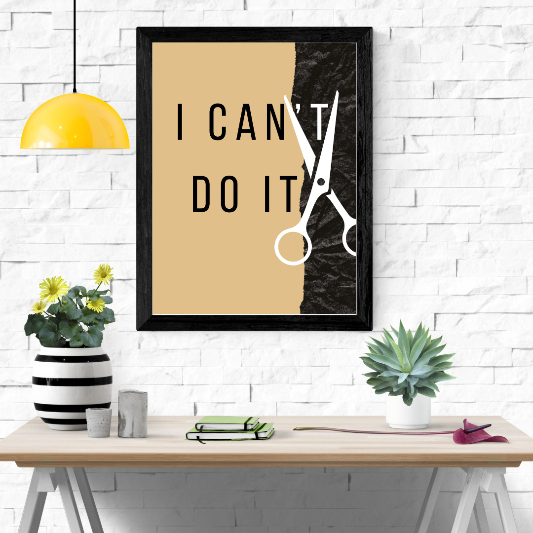 I Can Do It artwork on console table with stacked books and candle in a reading nook.