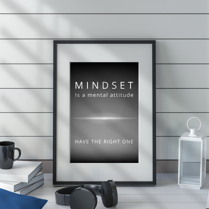 Mindset wall art on a shelf in a modern workspace with neutral tones.