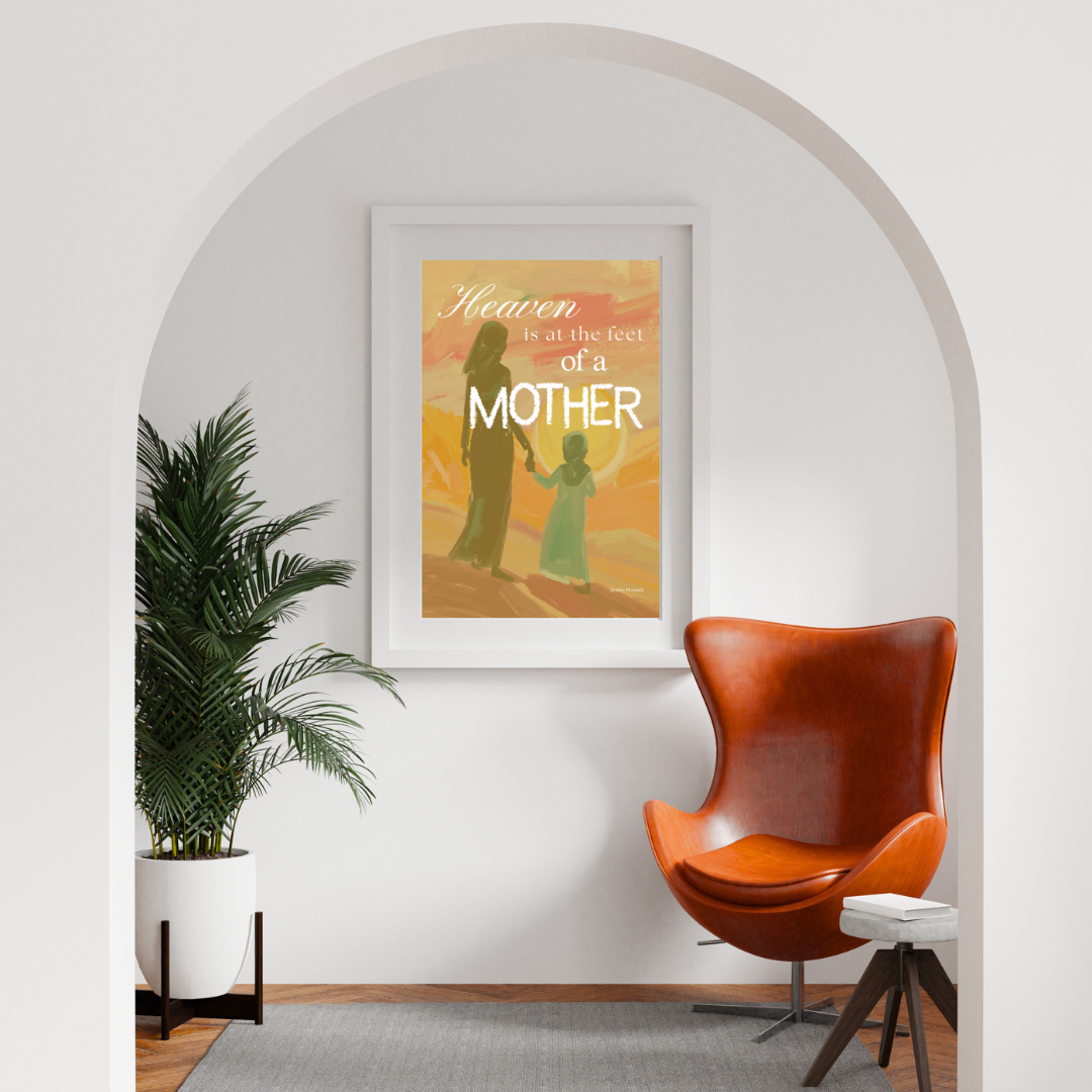 Framed artwork of a mother and child silhouette with text in a modern reading room with a brown chair and plant.
