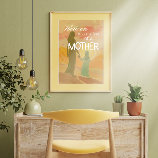 A digital inspirational wall art print with the text 'Heaven is at the feet of a MOTHER' framed and displayed in a room setting with decorative elements.