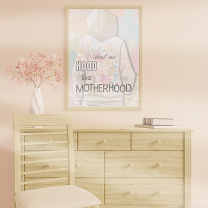 Inspirational mom quote artwork on modern console with stack of books and a flower vase.