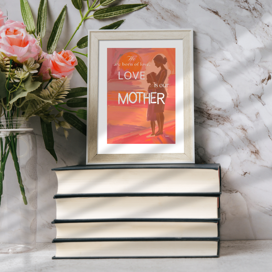 Framed artwork of a mother and child with text on a marble surface with flowers and books.
