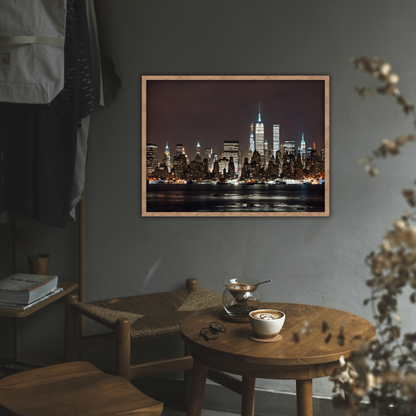 Reading nook with round table and NYC skyline print on the wall in a cozy setting with wooden decor.