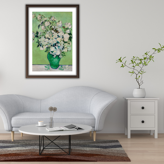 Framed Van Gogh “Roses” print above a white sofa in a bright modern living room.