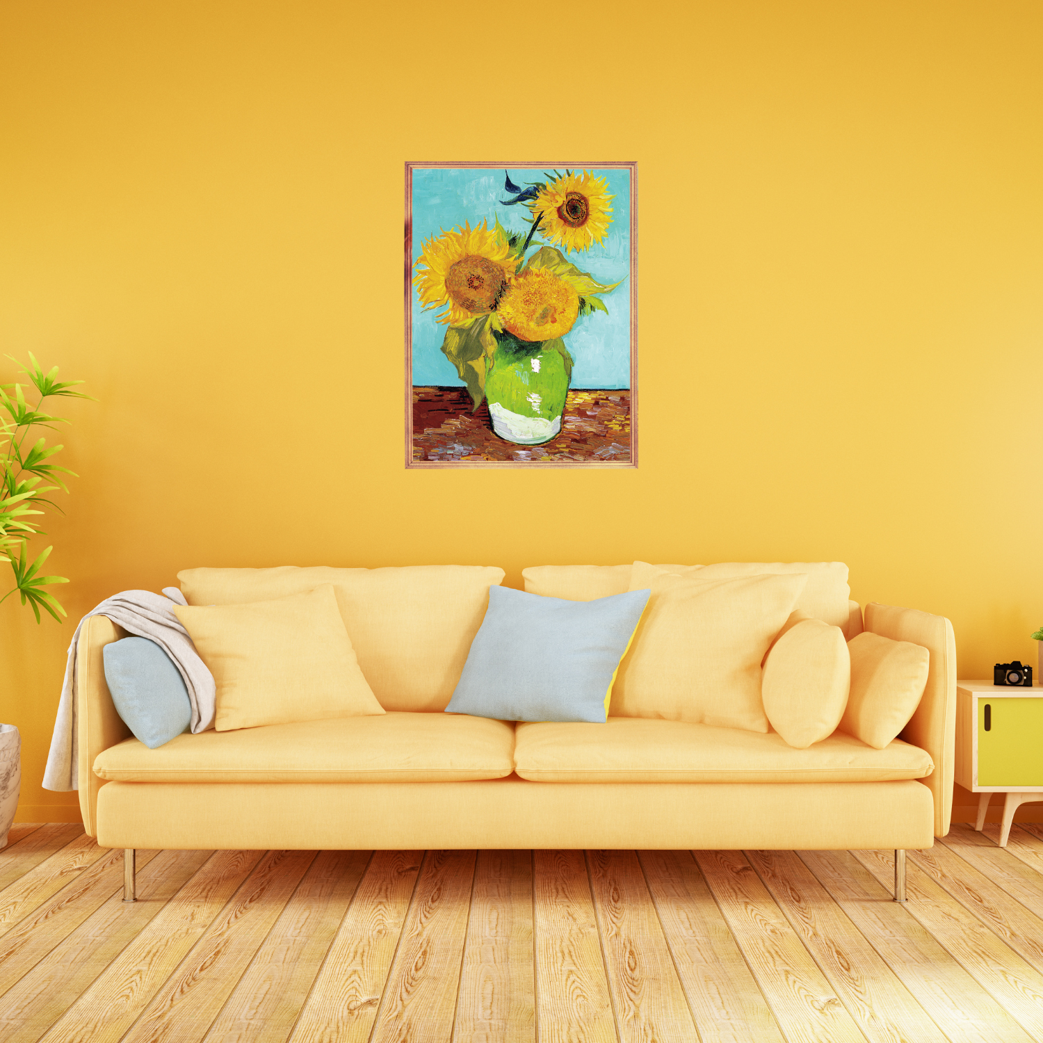 Framed Van Gogh Starry Night print above a yellow sofa in a modern and bright living room.