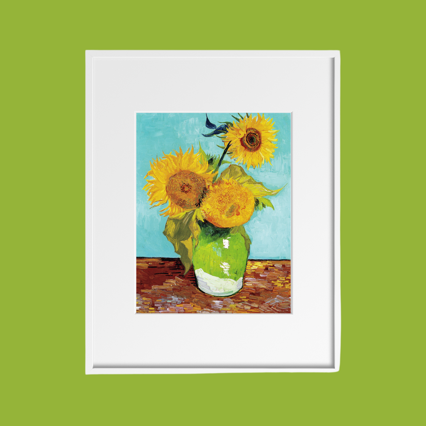 Close‑up of Sunflowers print in a white frame sitting on a lime green wall.