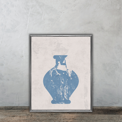 Framed artwork of a muted blue abstract vase on a neutral background, leaning against a textured wall on a wooden floor.