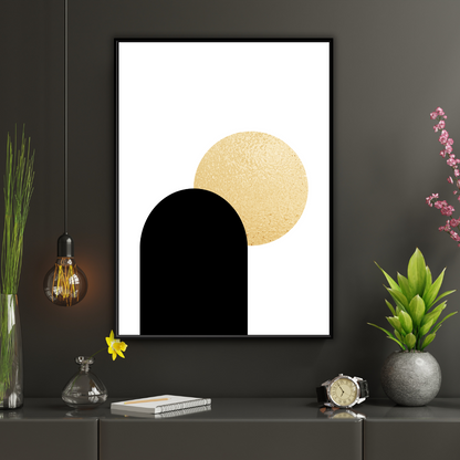 Framed boho style abstract art print with black arch and gold circles on a dark wall with decorative items.