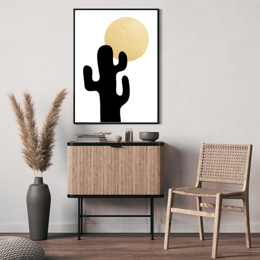 Modern neutral interior with a cactus artwork, wooden cabinet, and chair.