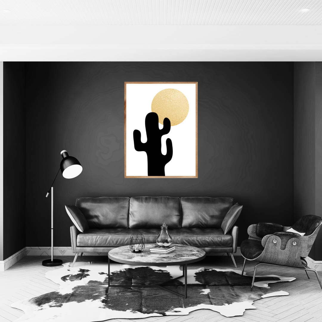 Modern living room with a black sofa, coffee table, and boho style abstract wall art featuring a cactus and sun.