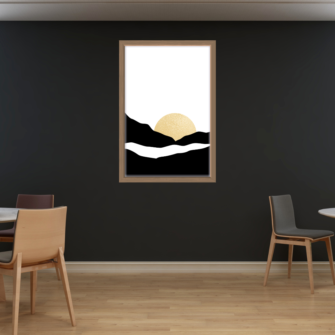 Framed boho abstract artwork mounted on a dark toned wall with chairs and a table below.