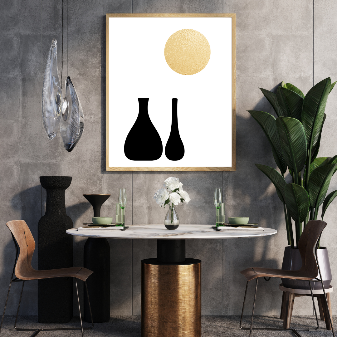 Modern interior breakfast nook, vases, and plant decor with a framed boho style wall art in black and gold mounted on a gray wall.