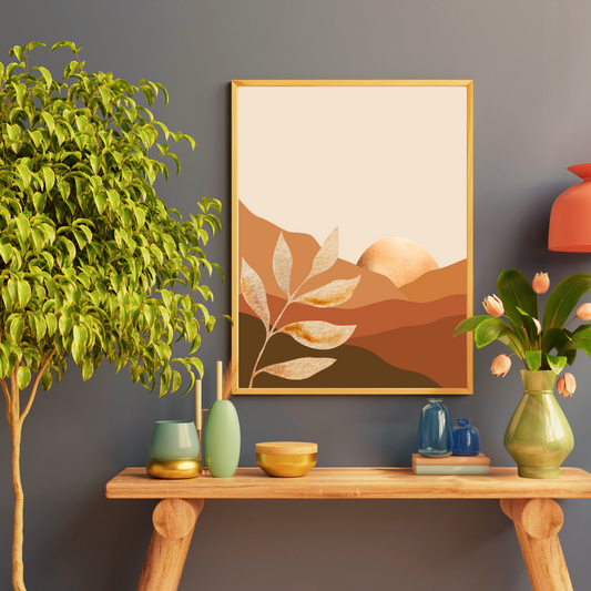 Boho digital wall art set with earth toned mountain and a golden sun framed above a wooden shelf with decorative items.