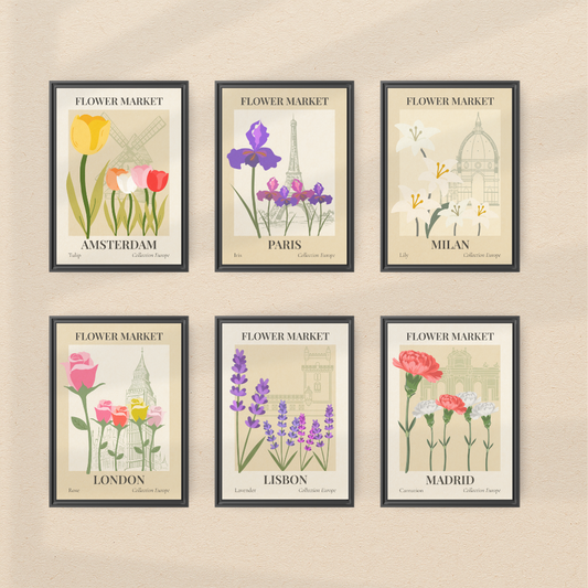Set of six framed floral prints with European city names on a beige wall.