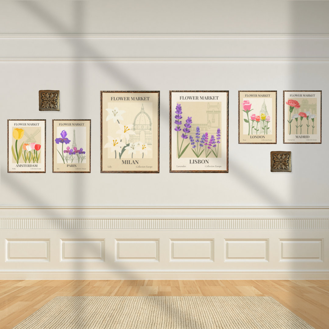 Set of flower market wall art prints of European flowers on a white wall with decorative molding.