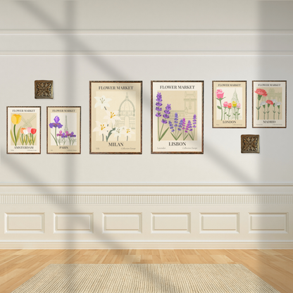 Set of flower market wall art prints of European flowers on a white wall with decorative molding.
