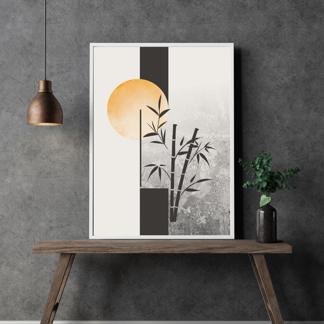 Close up of a framed Japandi artwork with bamboo design on a wooden table against a charcoal gray wall.