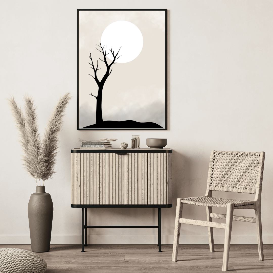 Modern interior with ratan furniture, and an abstract, minimalist and neutral wall art of a tree and moon.