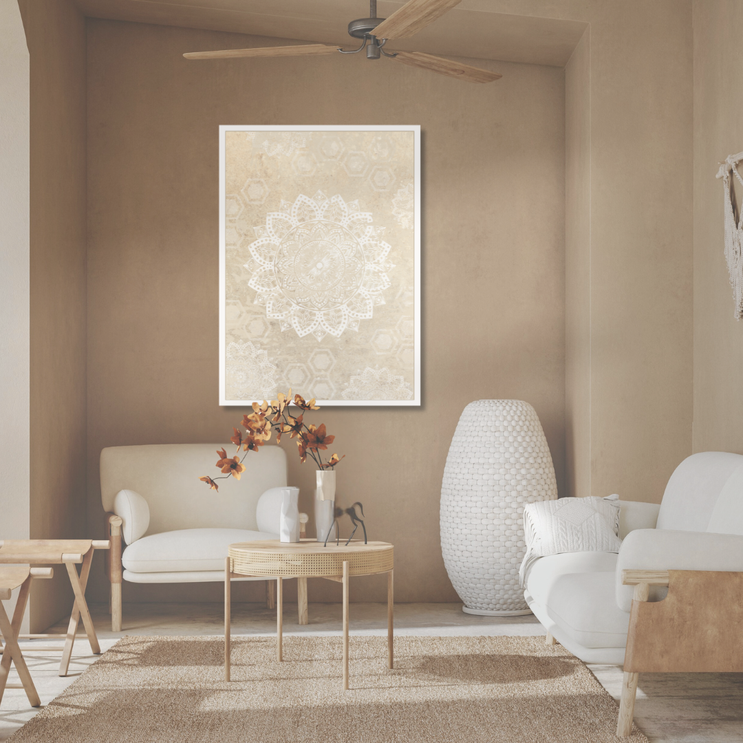 Living room with earth toned walls, white and ratan furniture, and a decorative neutral mandala painting.