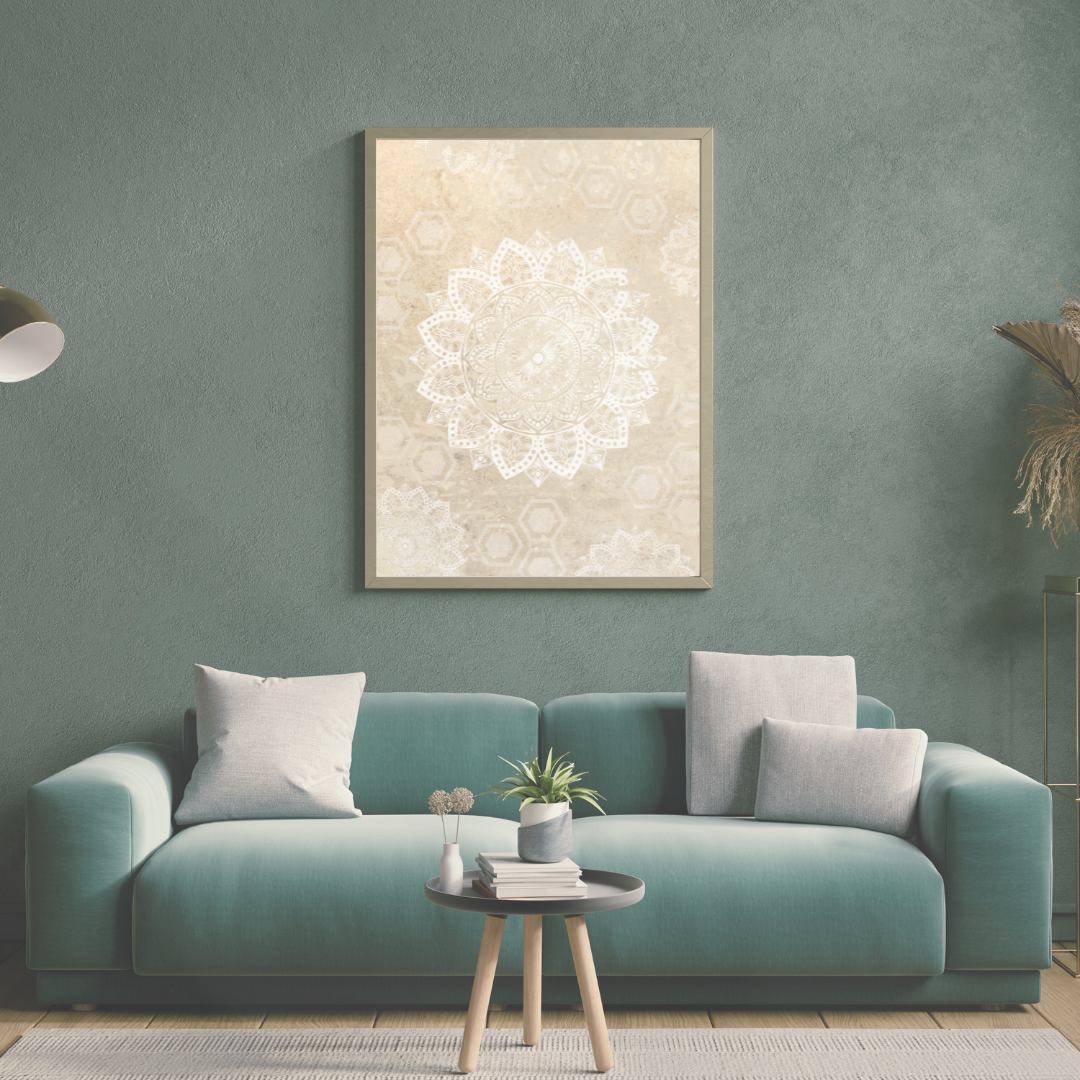 Modern living room with a teal sofa, decorative pillows, and a framed neutral artwork on a sage green wall.