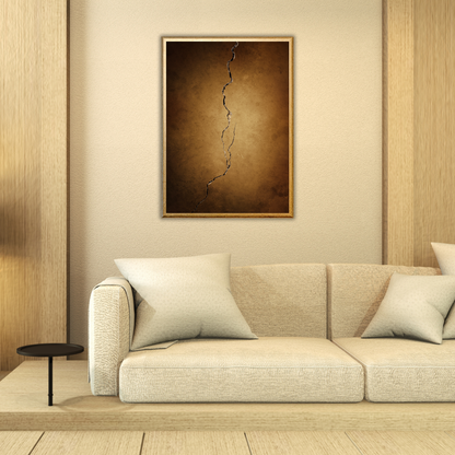 Beige sofa with decorative pillows in a room with wooden walls and a framed abstract painting.