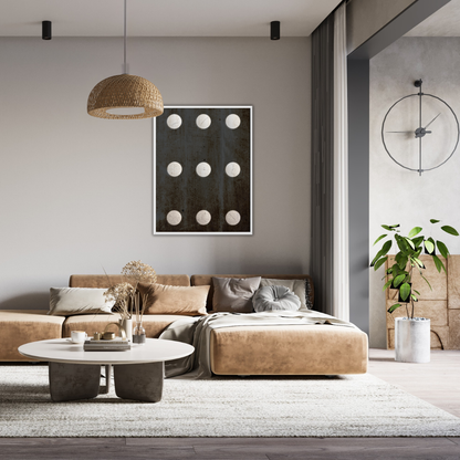 Modern living room with a beige sectional sofa, round coffee table, and decorative Wabi Sabi wall art.