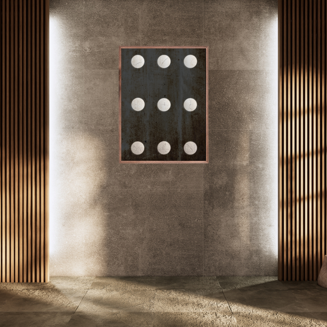 A Japandi styled interior featuring a decorative wall art with circular elements framed on a textured wall with wooden slats.