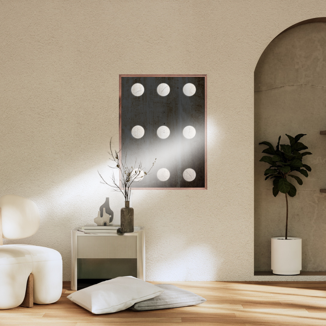 Modern Zen interior with a framed abstract wall art, white chair, and decorative items.